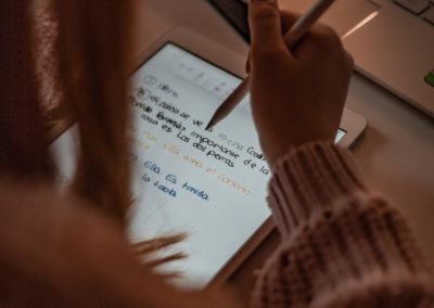 person writing on white paper
