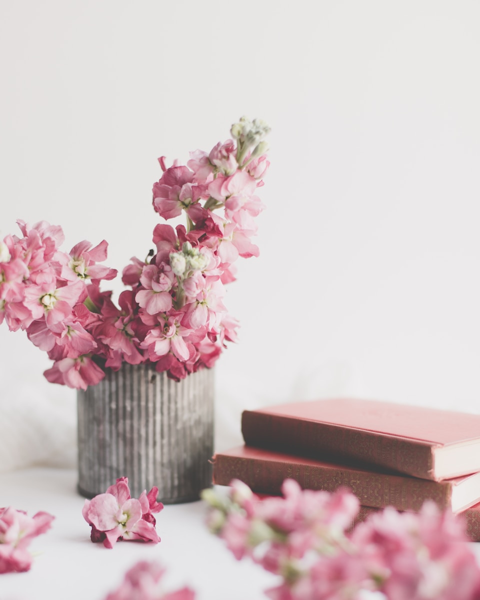Photo by Sixteen Miles Out pink flowers on brown wooden vase
